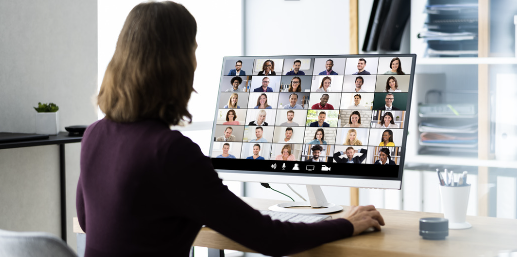 Photo of an educator working with a classroom of students in an online platform